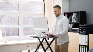 Person using Adjustable Desk in Office Space